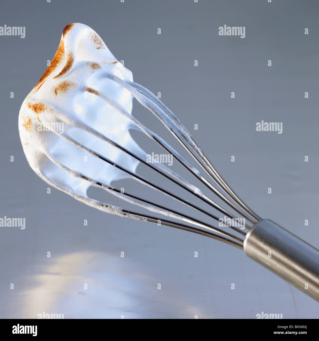 Grilled meringue on a whisk Stock Photo