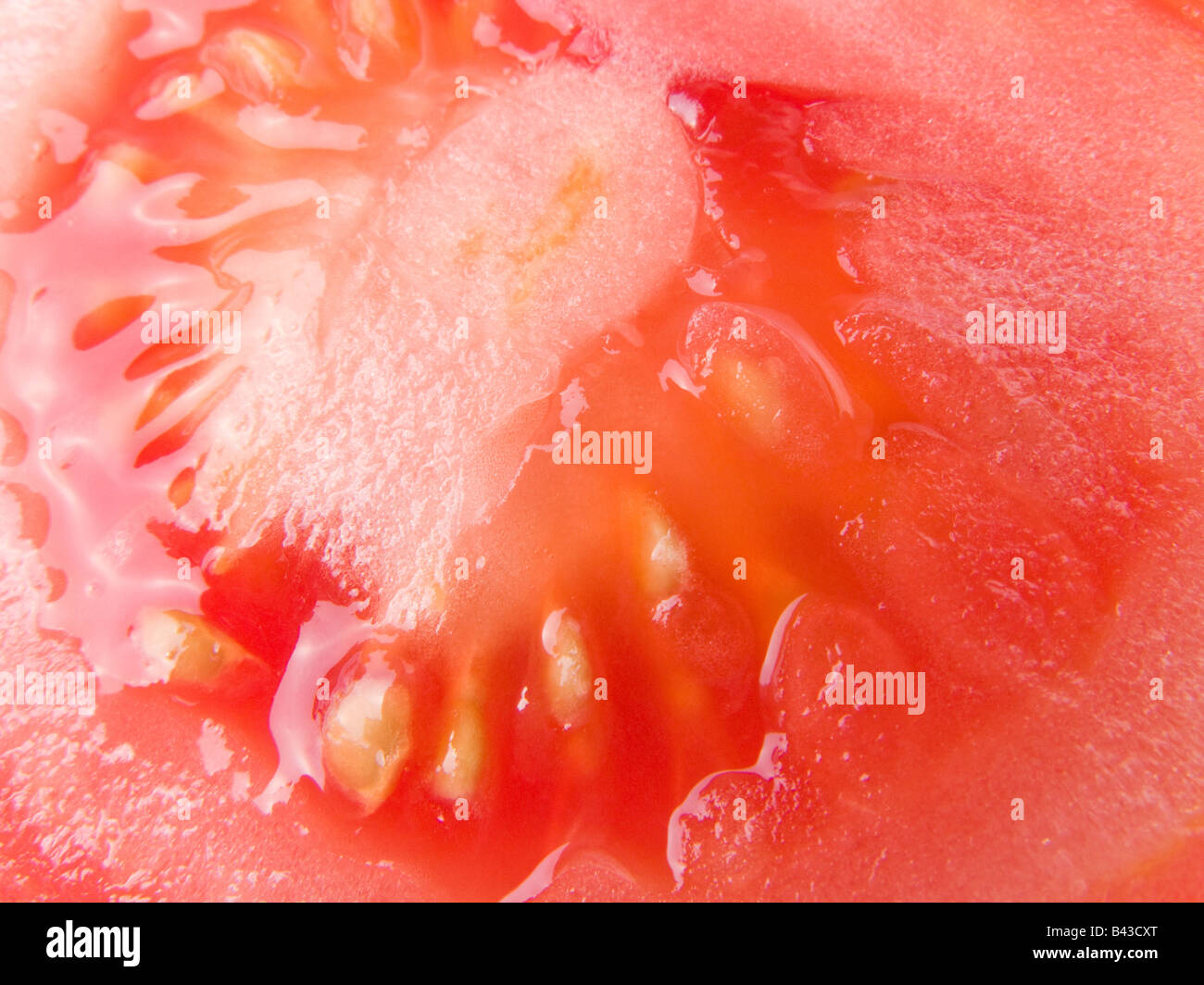 Close up of the interior of a ripe tomato with seeds Stock Photo