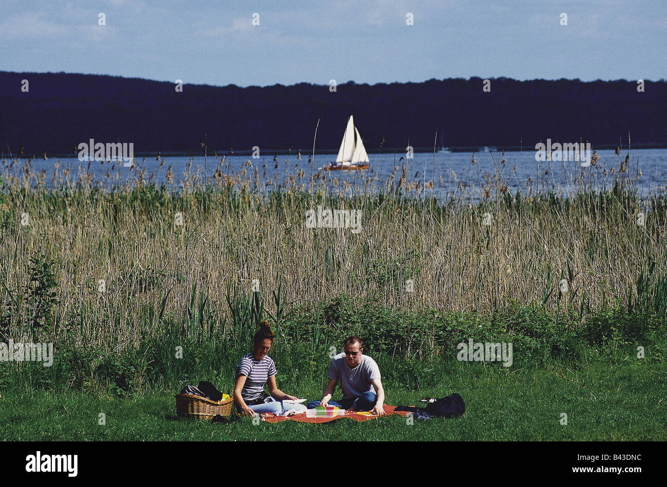 geography / travel, Germany, Brandenburg, Petzow, couple, picnic, boat, sailboat, Schwielowsee Lake, , Additional-Rights-Clearance-Info-Not-Available Stock Photo