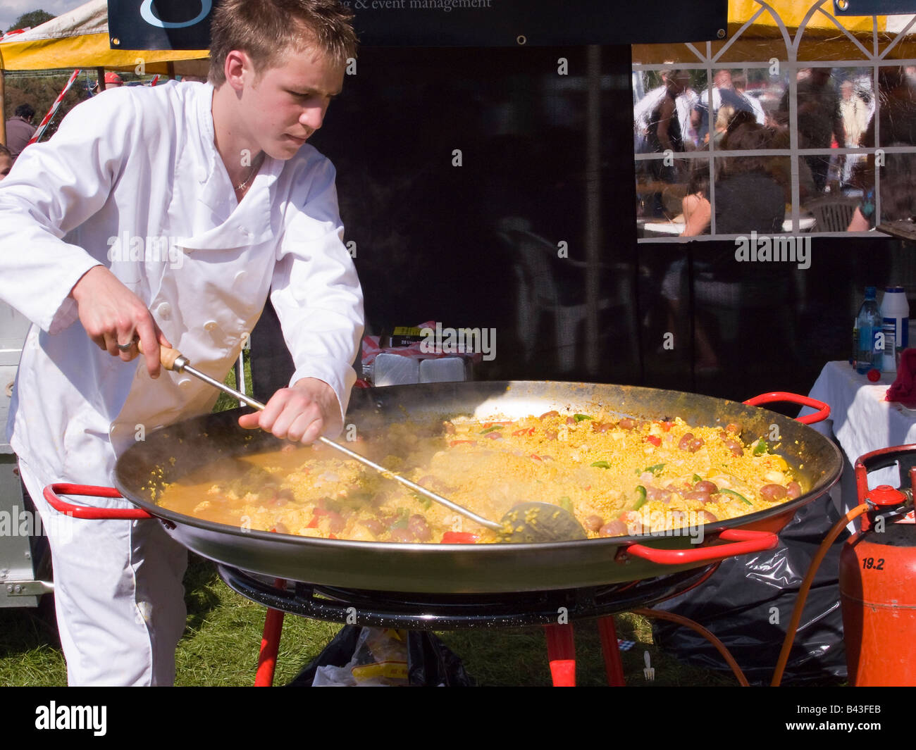 Large skillet of Paella being cooked outdoors Stock Photo - Alamy