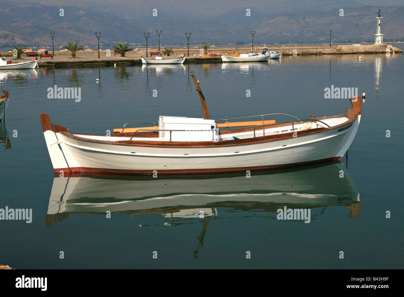 Boat reflection in Nafplion Harbour Stock Photo