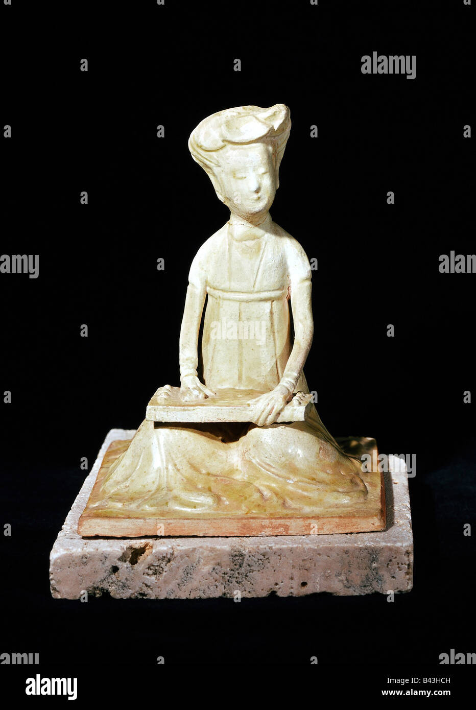 fine arts - China, ceramics, sitting musician, green - yellow glaze, 16 cm, Tang Dynasty (618 - 906), private collection, , Artist's Copyright has not to be cleared Stock Photo