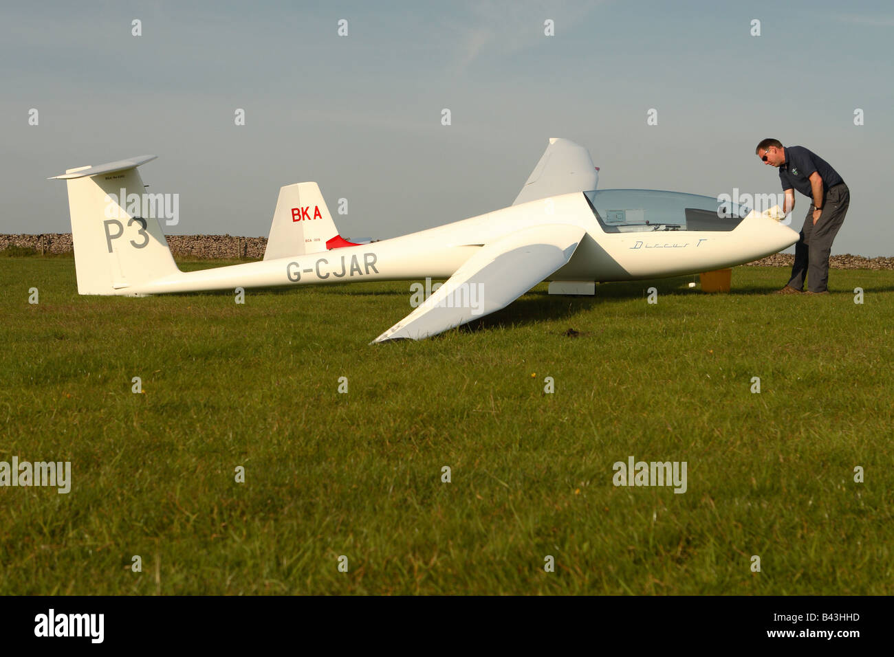 Schempp Hirth Discus BT glider sailplane being washed polished in the evening after a days flying Stock Photo