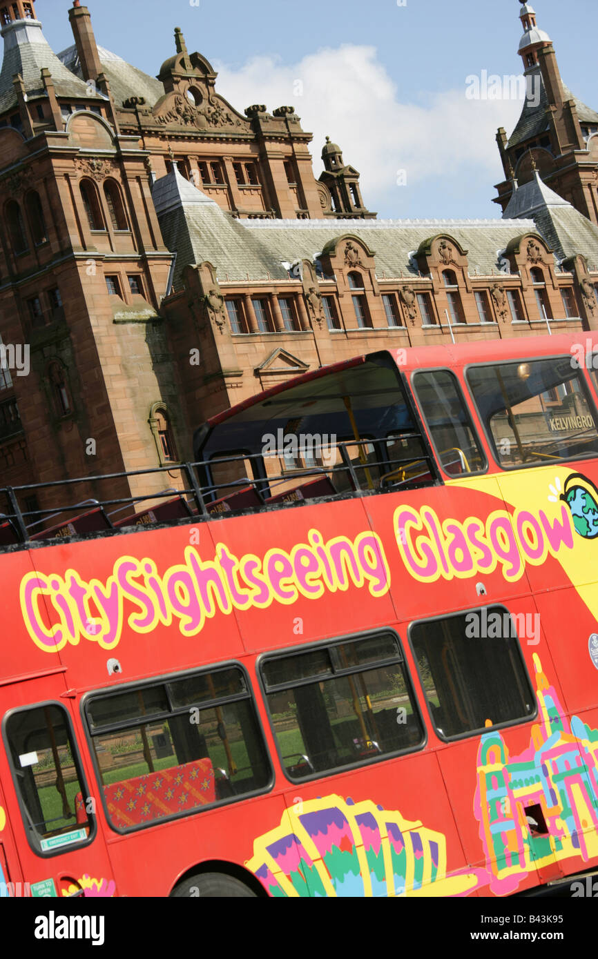 City of Glasgow, Scotland. Angled view of a Glasgow City Sightseeing tour bus outside Kelvingrove Art Gallery and Museum. Stock Photo