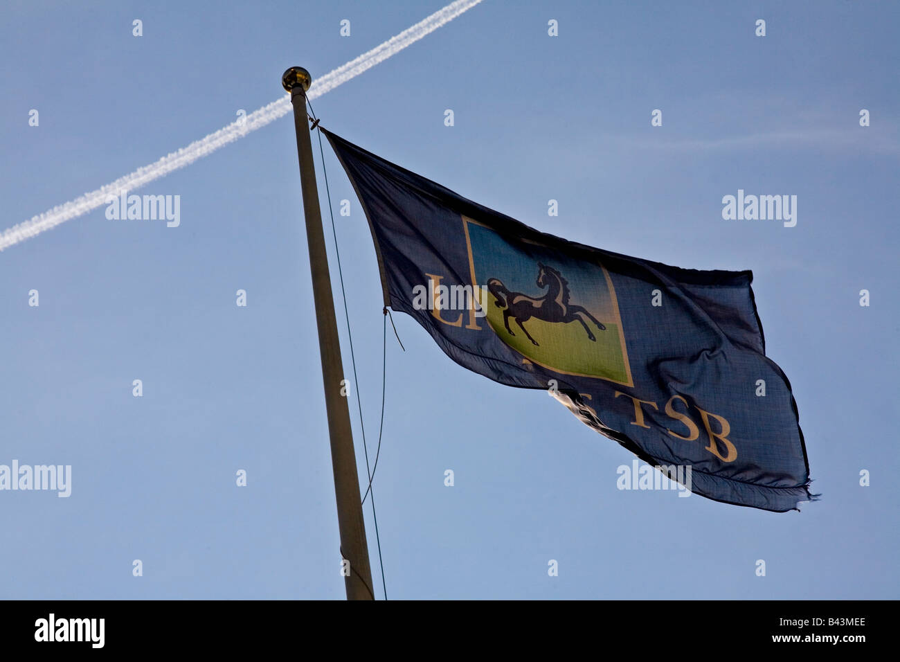 Lloyds TSB flag atop bank branch in City of London Stock Photo