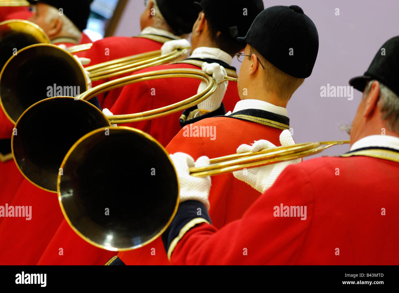 Group of french musicians playing on hunting horn and with traditional