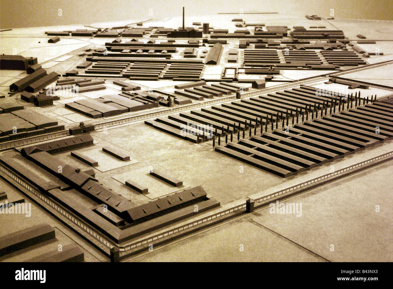 geography / travel, Nazi Germany, Bavaria, Dachau, miniature of the concentration camp Dachau in April 1945 shortly before the liberation, detail, prisoner camp with fence and watch-towers, accommodation huts for prisoners, sick person area huts, camp street with poplars, building for labour, so called jour house, the central gate to the camp, the fenced camp is today a memorial square, symbol, terrorism, nazism, nazi, ns, holocaust, persecution of the Jews, third reich, watch tower, hut, further buildings, district heating plant, , Additional-Rights-Clearance-Info-Not-Available Stock Photo