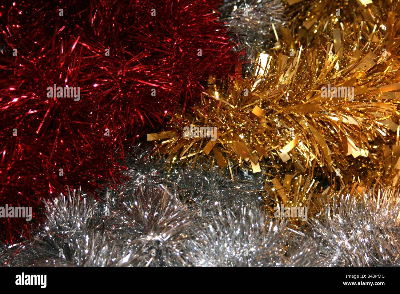 Red gold and silver christmas decoration tinsel Stock Photo