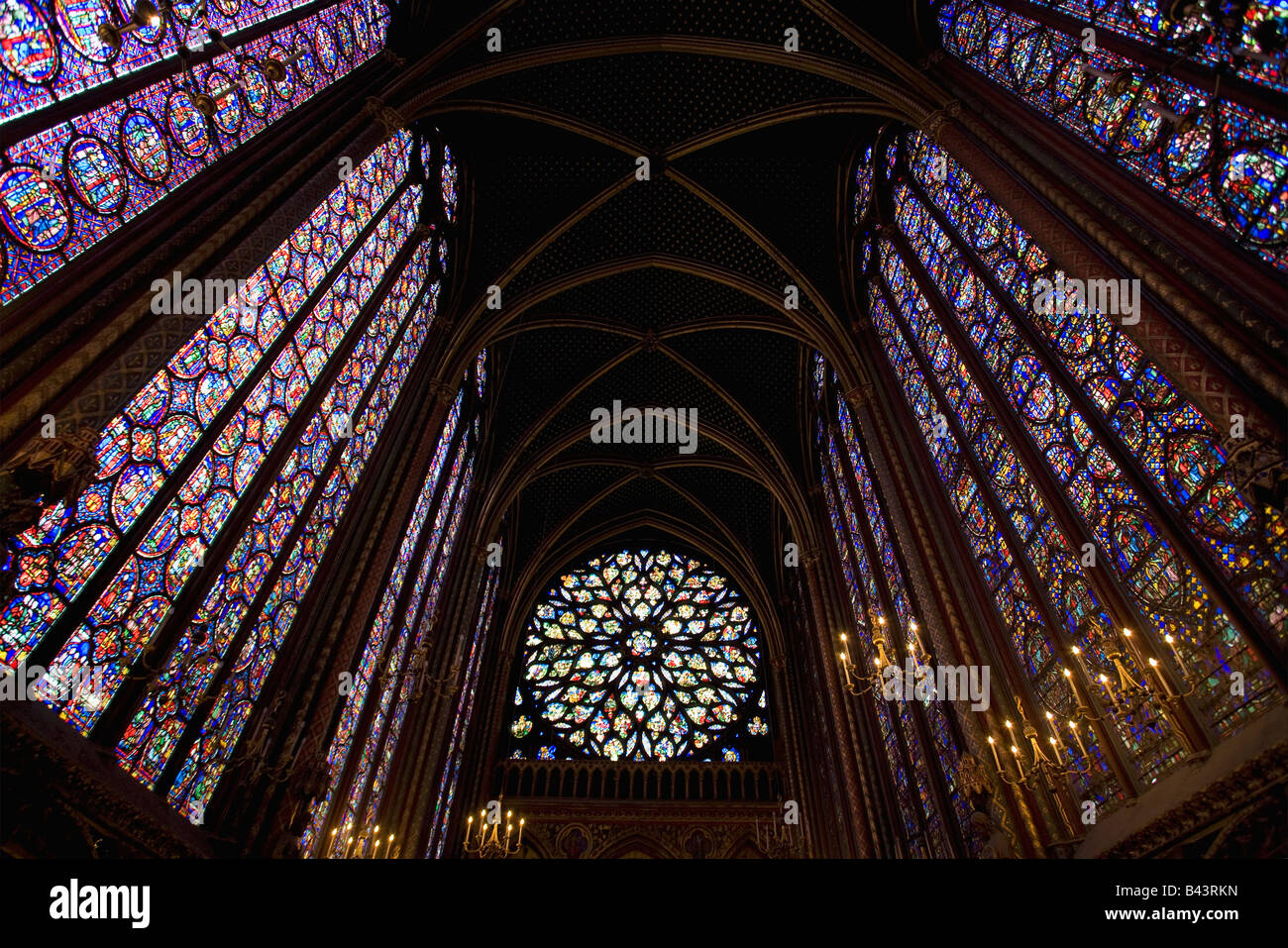 Interior of SainteChapelle showing medieval stained glass window panels Paris France Europe