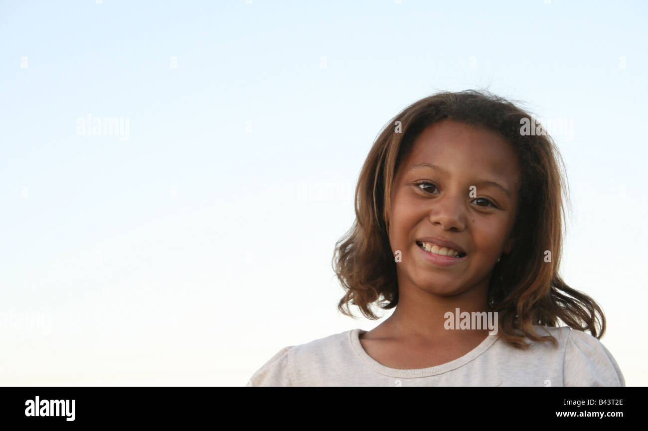 Young african american girl smiling happily Stock Photo - Alamy