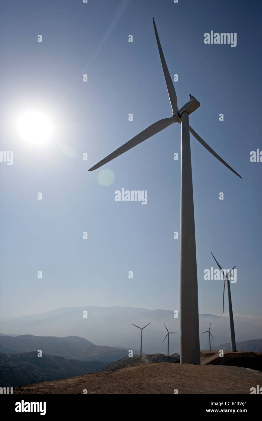 Wind powered electricity generating turbines up on towers. Stock Photo