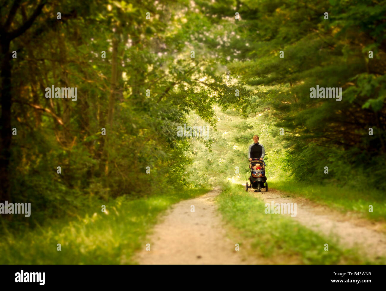 Mother and child walking on a country lane Stock Photo