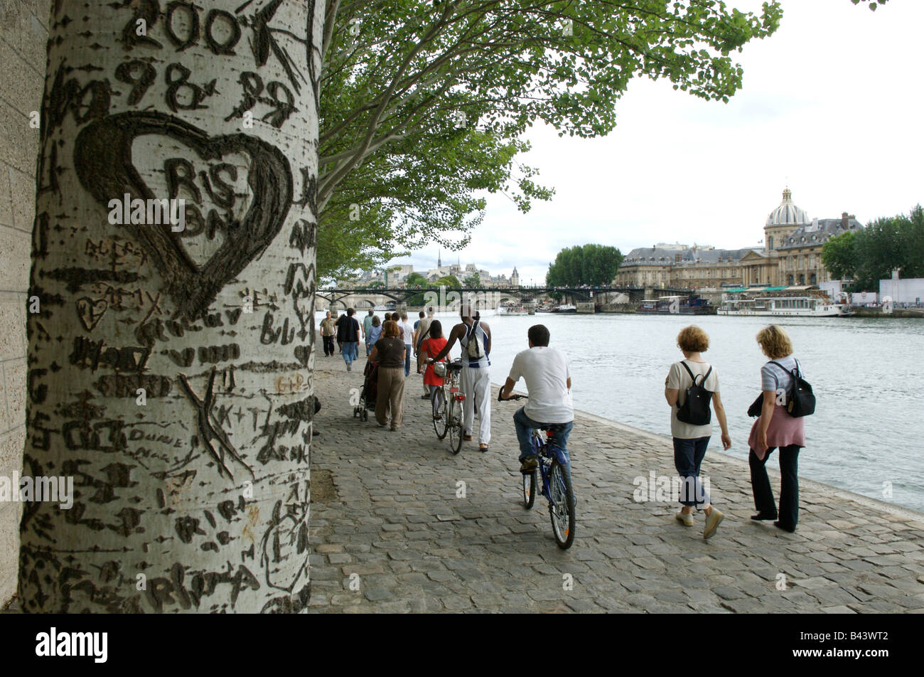 Enjoying a stroll along the river bank in Paris Stock Photo