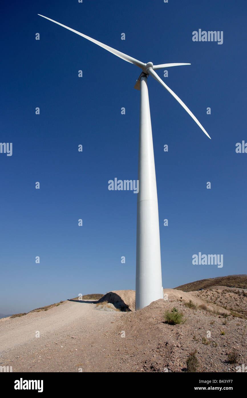 Wind powered electricity generating turbines up on towers. Stock Photo