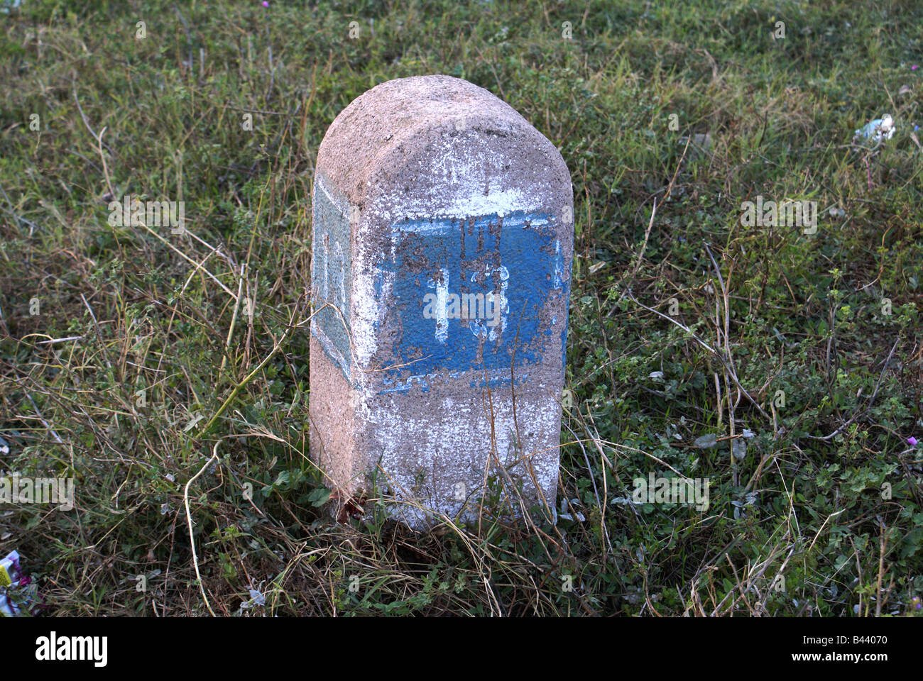 A metric stone with number thirteen Stock Photo