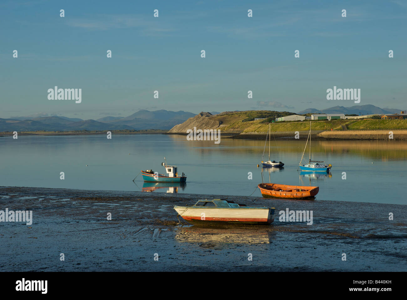 Boats in Walney Channel, between Walney Island and Barrow-in-Furness, Cumbria, England UK, with lakelsnd mills in the distance Stock Photo