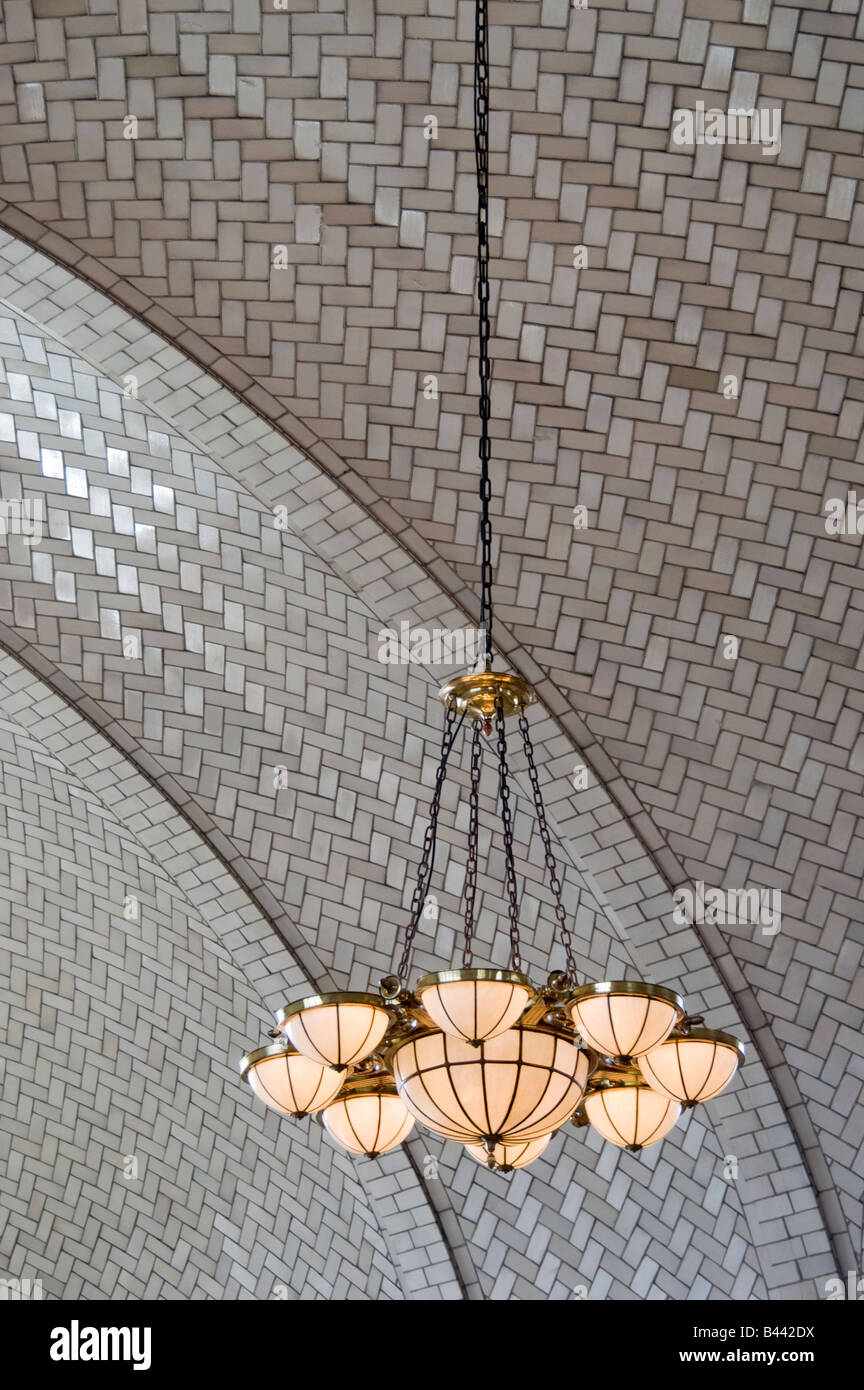 Interior ceiling and chandelier detail at Ellis Island in New York harbor Stock Photo