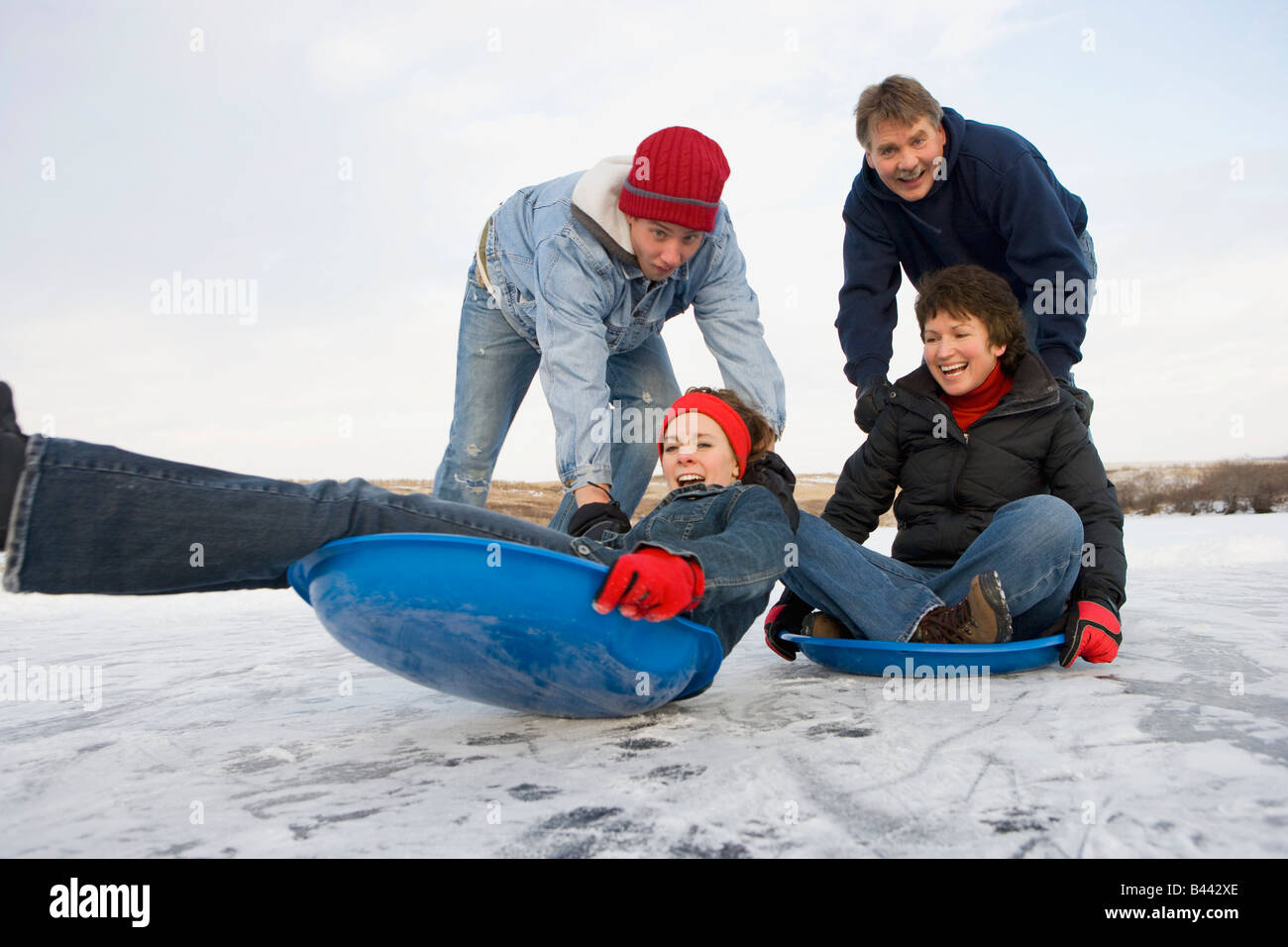 Family enjoying the winter Stock Photo - Alamy