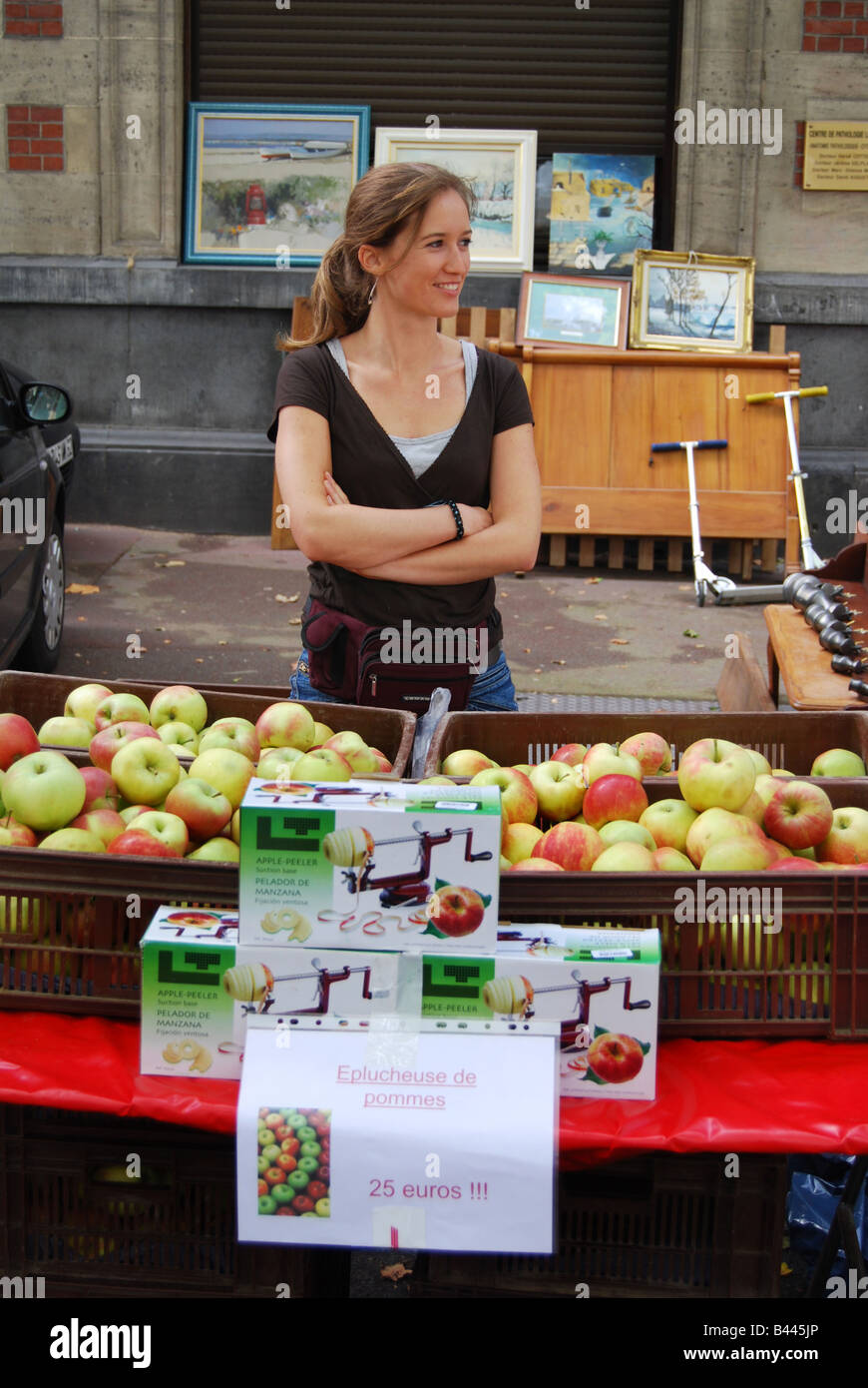 young woman selling apples at Lille Braderie Stock Photo