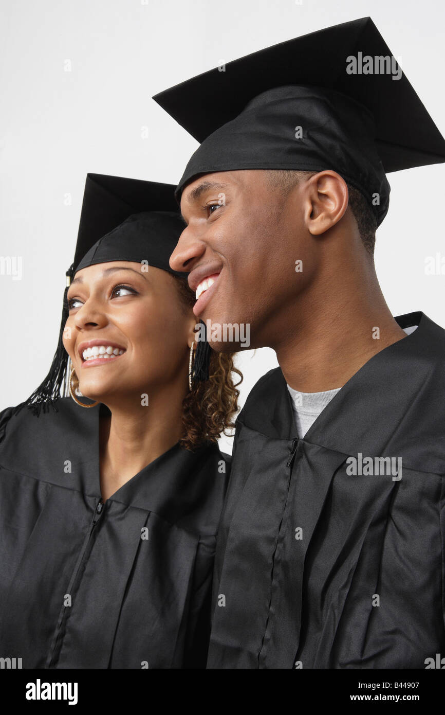African couple wearing graduation cap and gown Stock Photo Alamy