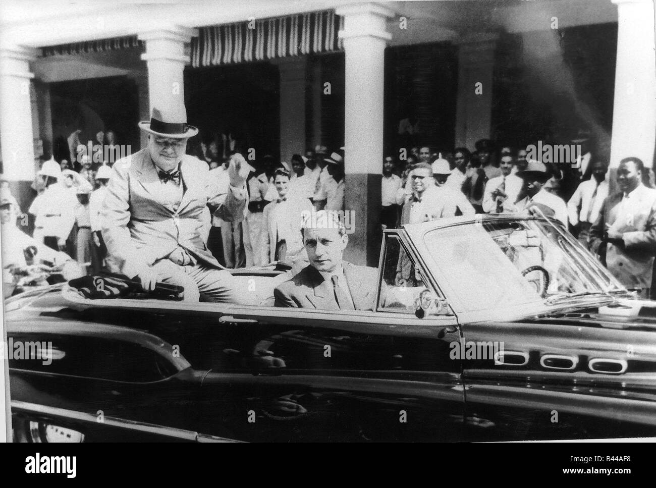 Cyril Davies Winston Churchills bodyguard driving him through Kingston Jamaica receiving key to the city circa 1940s or 1950s Stock Photo
