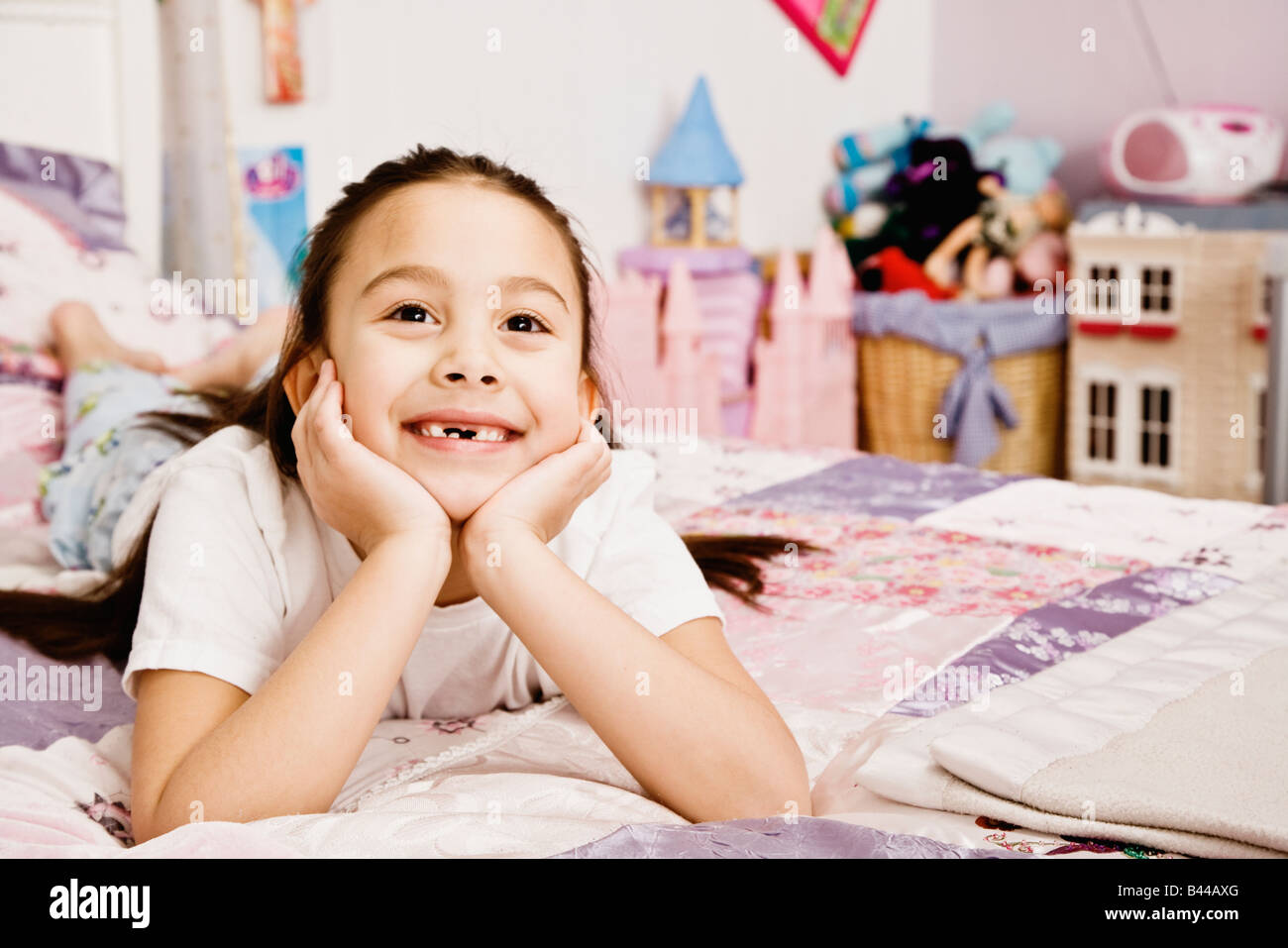 Asian girl laying on bed Stock Photo Alamy