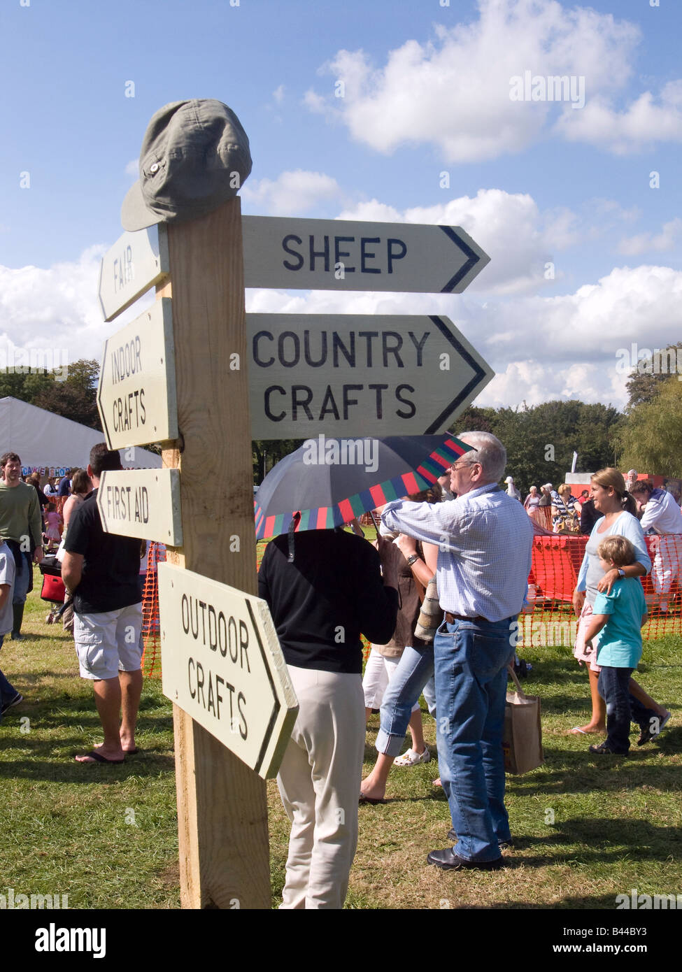Signpost pointing out the various attractions at Findon Sheep Fair, Findon Village, West Sussex, England, UK Stock Photo