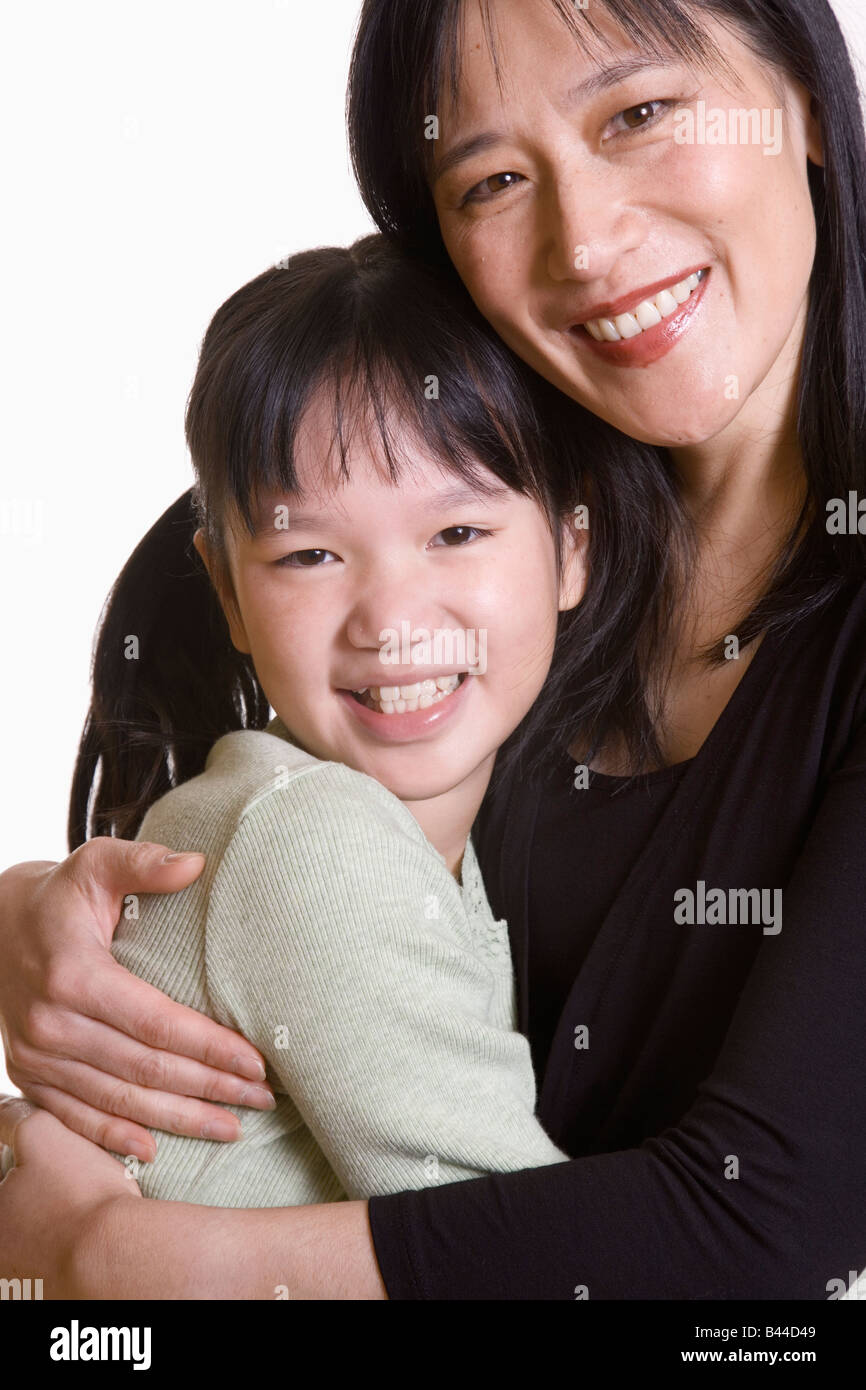 Asian mother and daughter hugging Stock Photo - Alamy