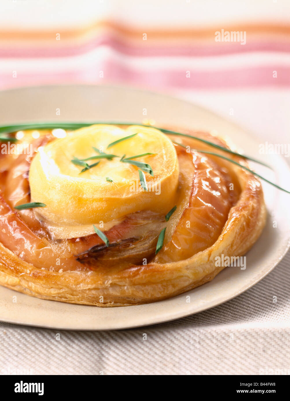 Apple,goat's cheese and onion tatin tart Stock Photo Alamy