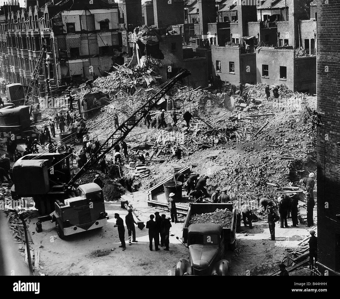 Workmen search a building at Elephant and Castle London which was hit ...