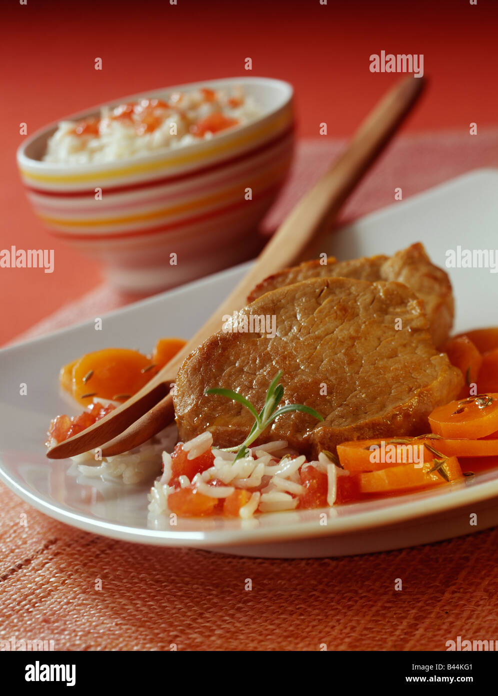 Veal filet mignon with rice,carrots and tomatoes Stock Photo Alamy