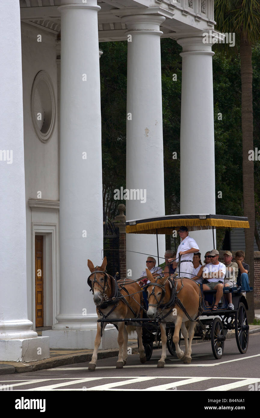 A horse carriage tour stops to view a church along historic Meeting