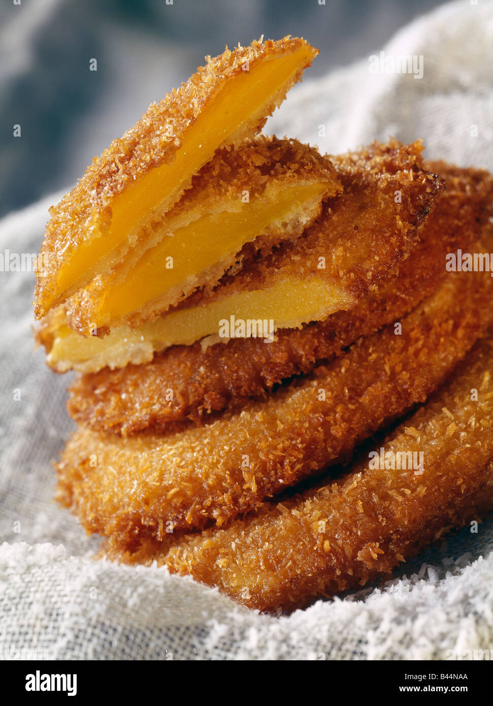 sliced mango covered in coconut and deep fried Stock Photo - Alamy
