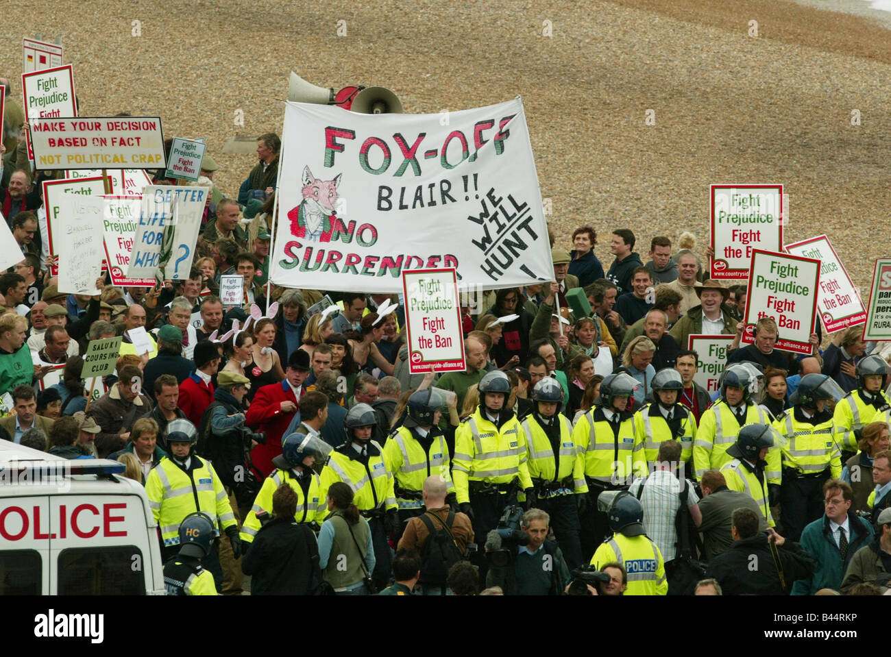 Pro hunting demonstrators are held back by a cordon of police officers at the Labour Party Conference in Brighton Stock Photo