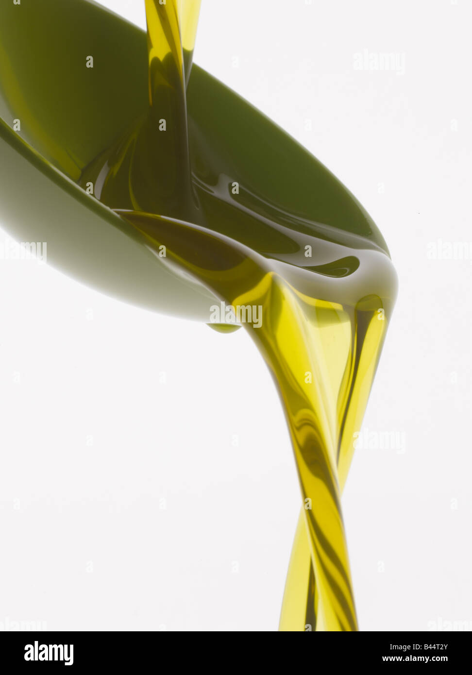 Pouring olive oil into a spoon Stock Photo - Alamy