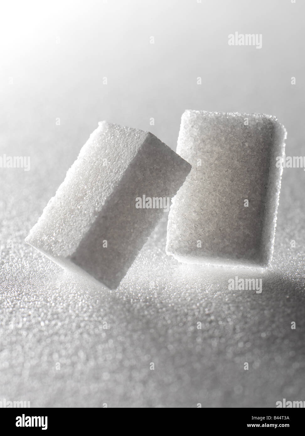 Two sugar lumps Stock Photo - Alamy