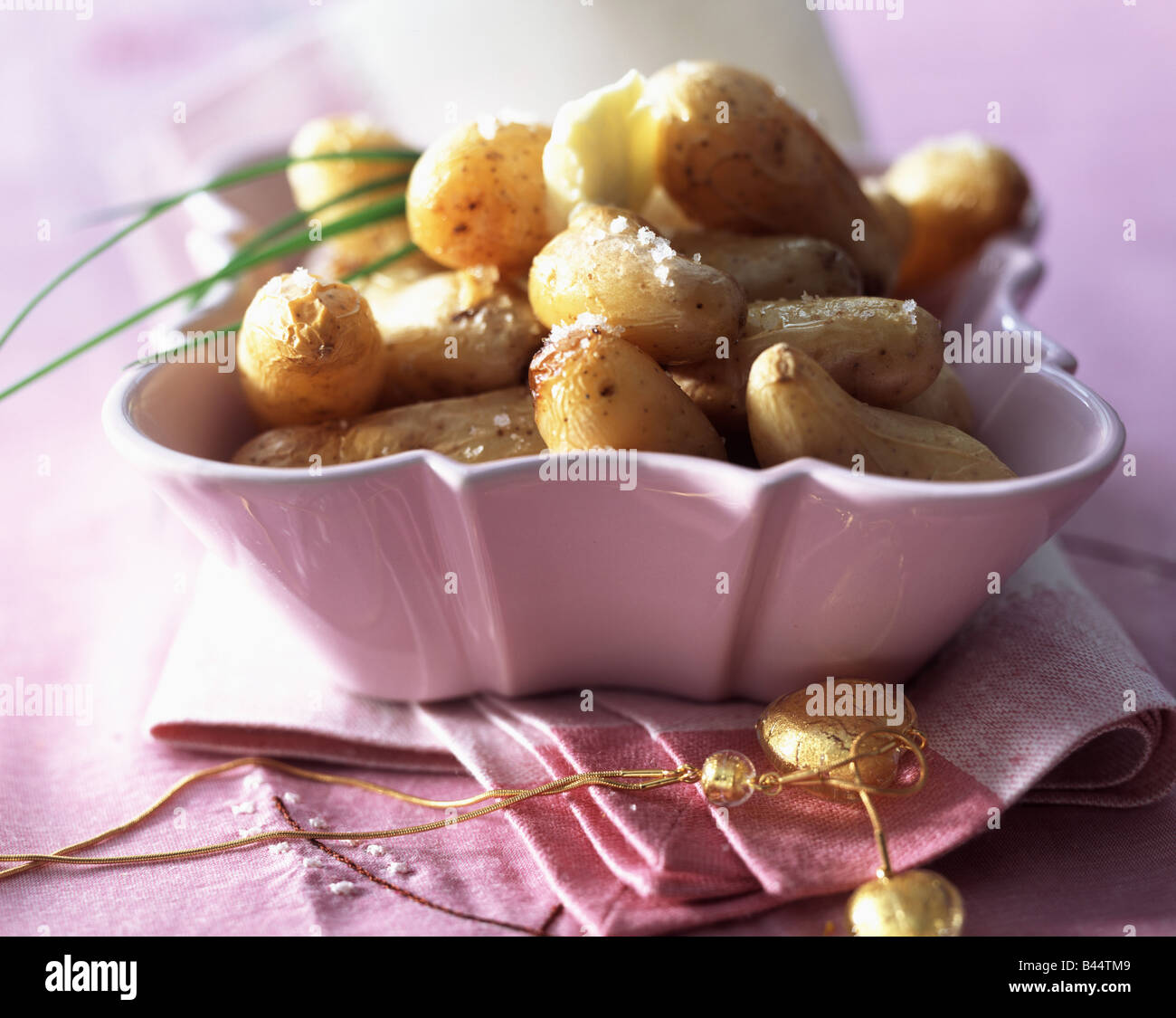 Grenaille potatoes with fleur de sel salt Stock Photo - Alamy
