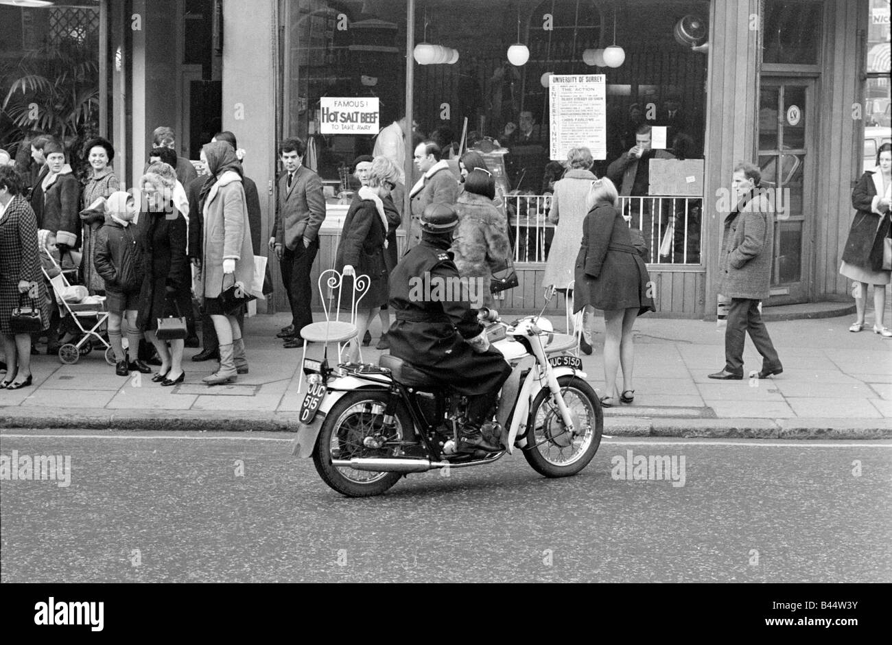 Motorcycle Policeman Orders Three Models Wearing Swimsuits Sitting Outside Guys And Dolls Kings Road Chelsea London Motorcycle Policeman Orders Three Models Wearing Swimsuits Sitting Outside Guys And Dolls Kings Road Chelsea London