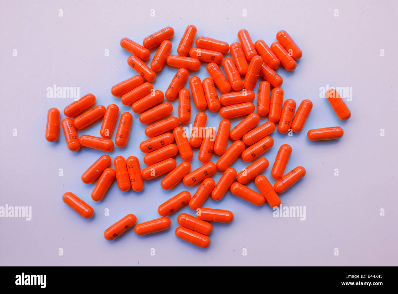 Orange pharmaceutical drug capsules Stock Photo Alamy