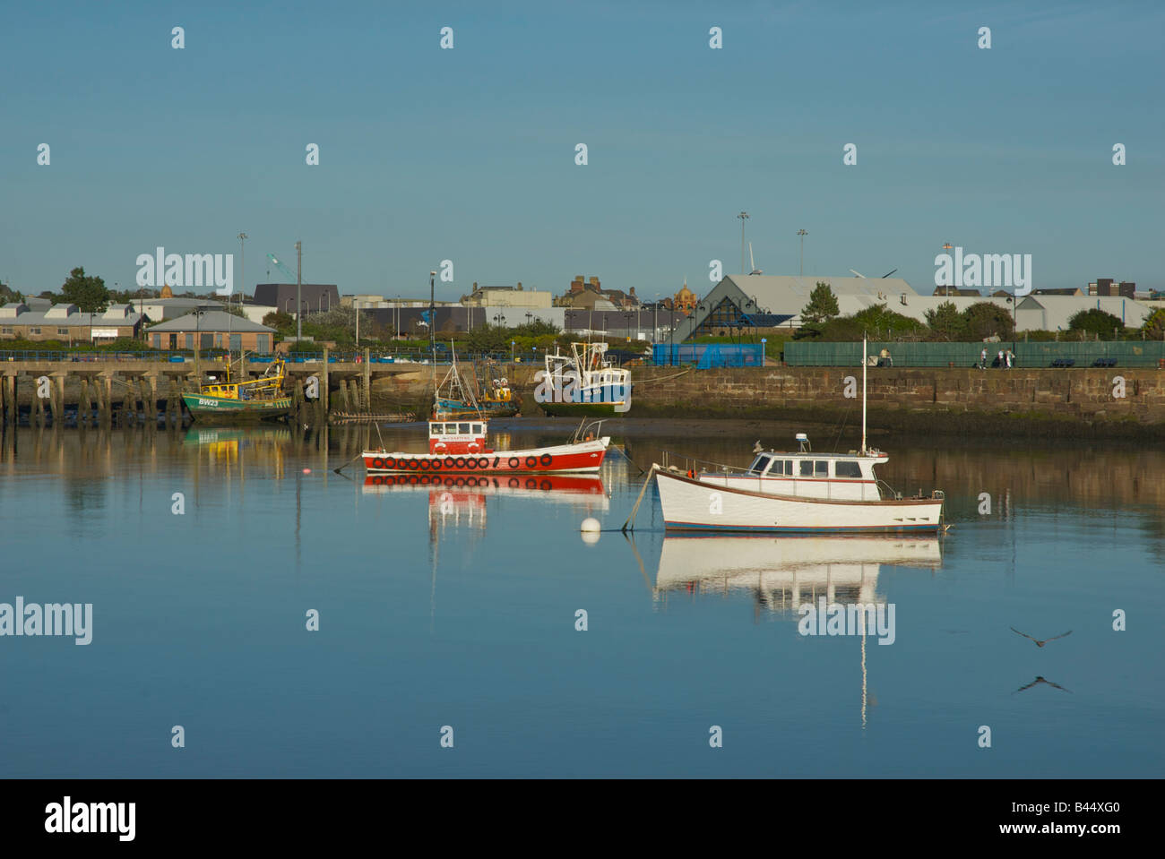 Boats in Walney Channel, between Walney Island and Barrow-in-Furness, Cumbria, England UK, with Dock Museum in background Stock Photo