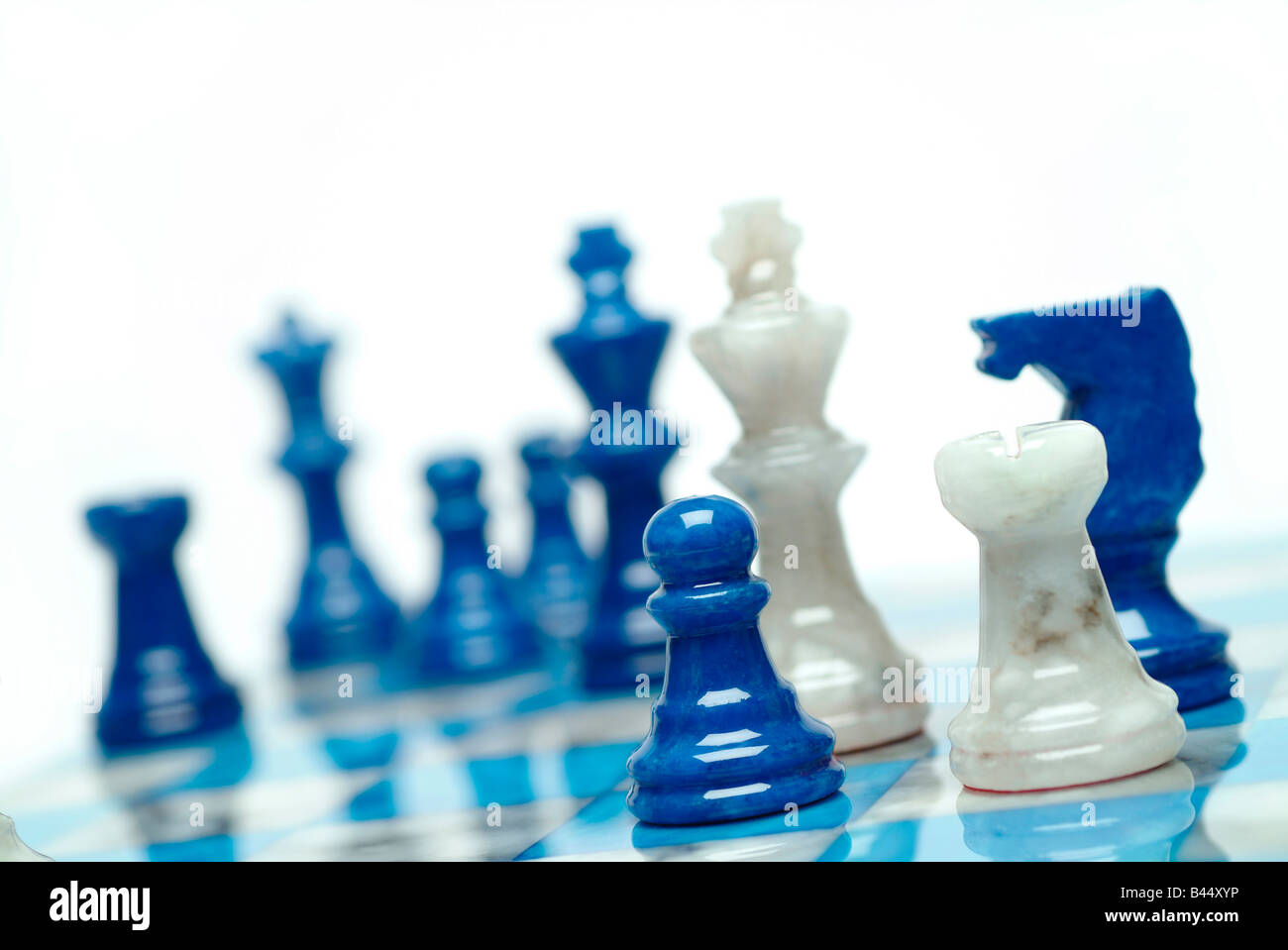 White Icons Chess Pieces Blue Background Stock Photo by ©Wirestock 467231890