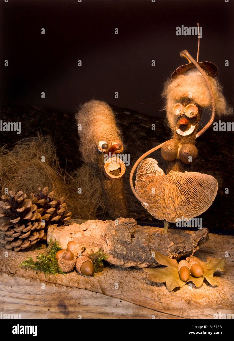 Figurines made of natural materials dancing in an autumn decor Stock