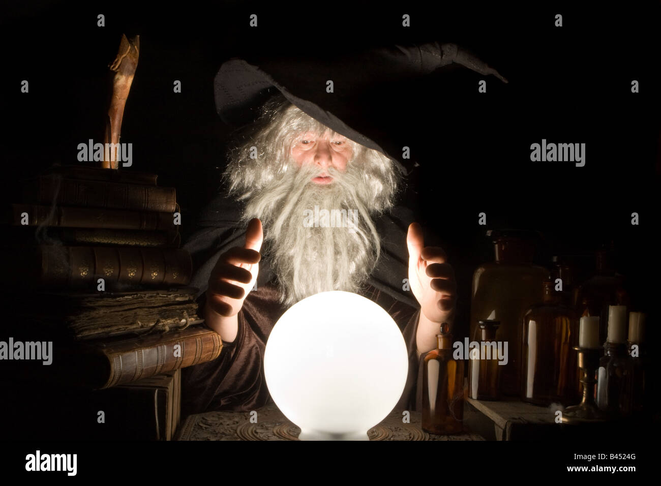 Fortune telling wizard at work at halloween Stock Photo