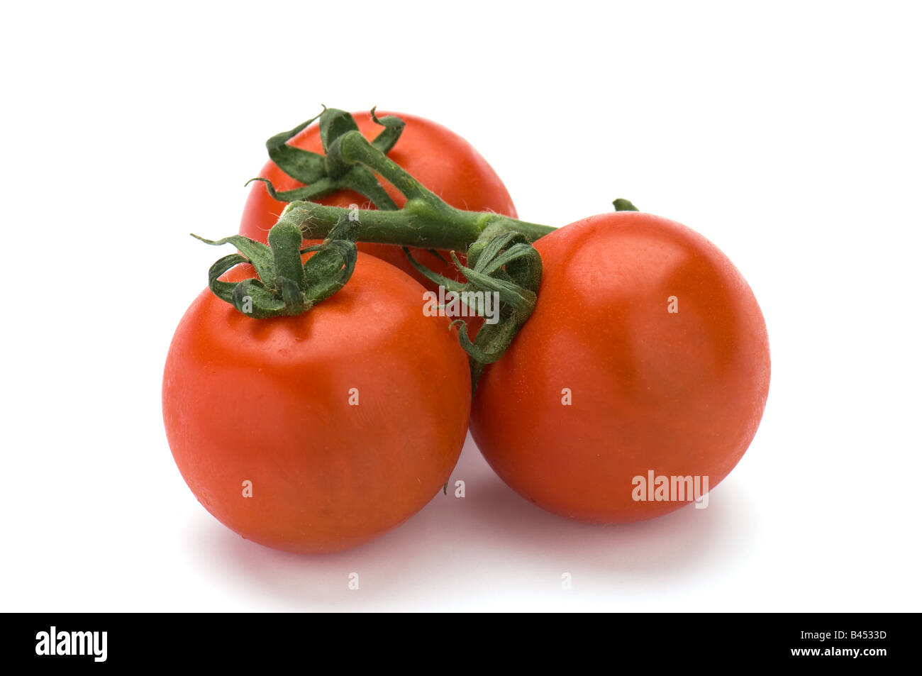 Red tomatoes isolated on a white background Stock Photo - Alamy