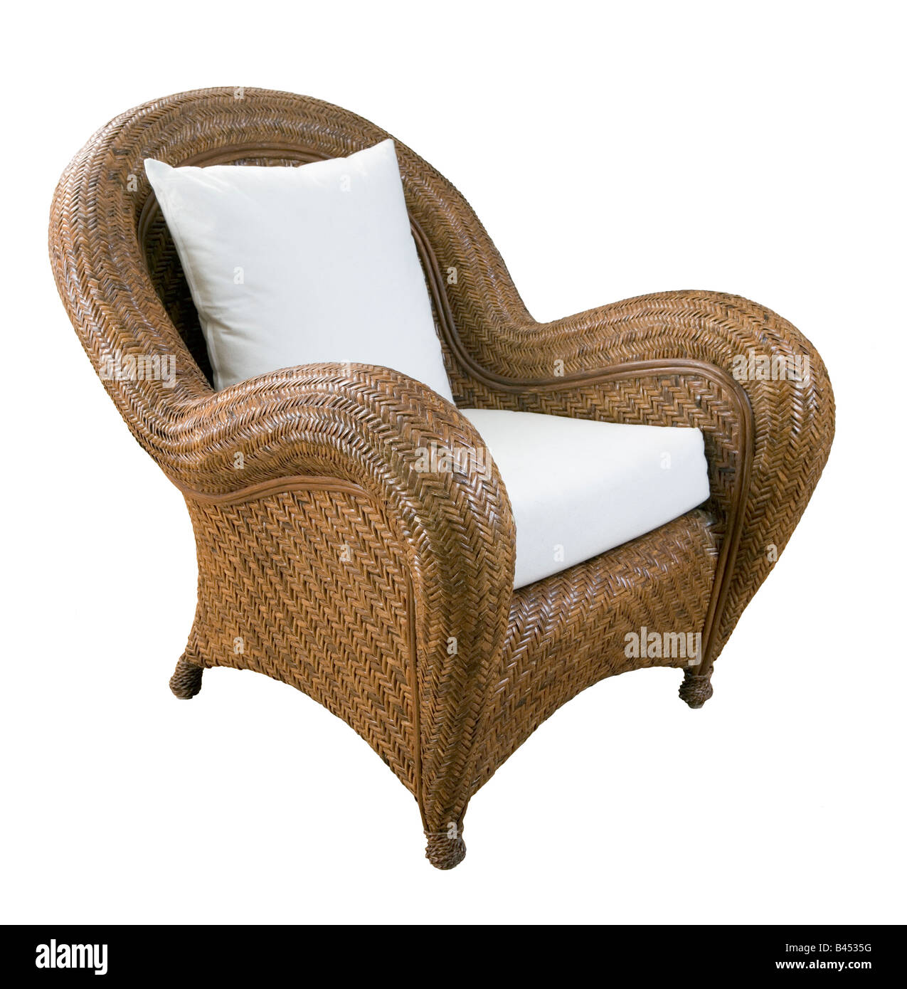 A large wicker chair with white cushions Stock Photo