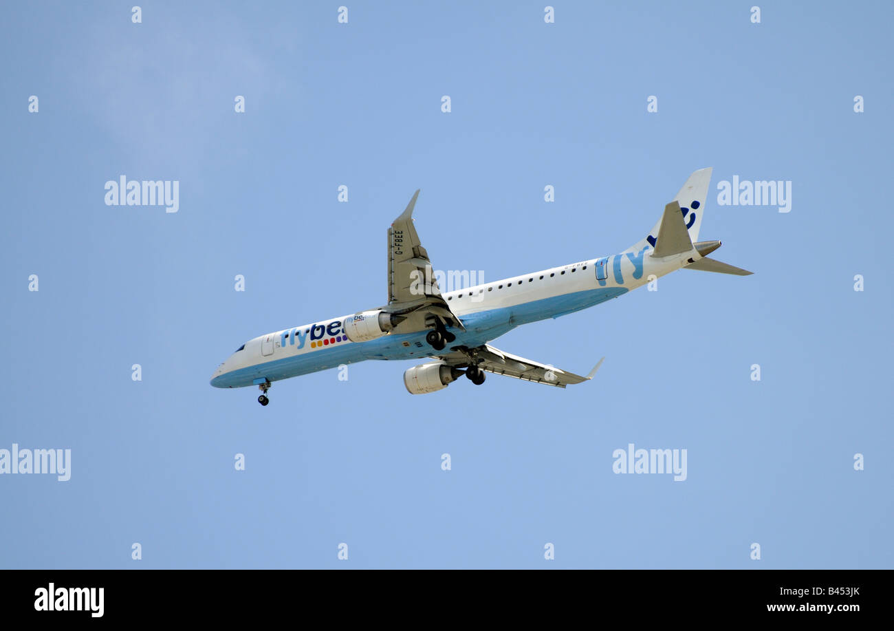Flybe company Embraer 195 200 passenger jet on finals and approaching its Southampton base Stock Photo