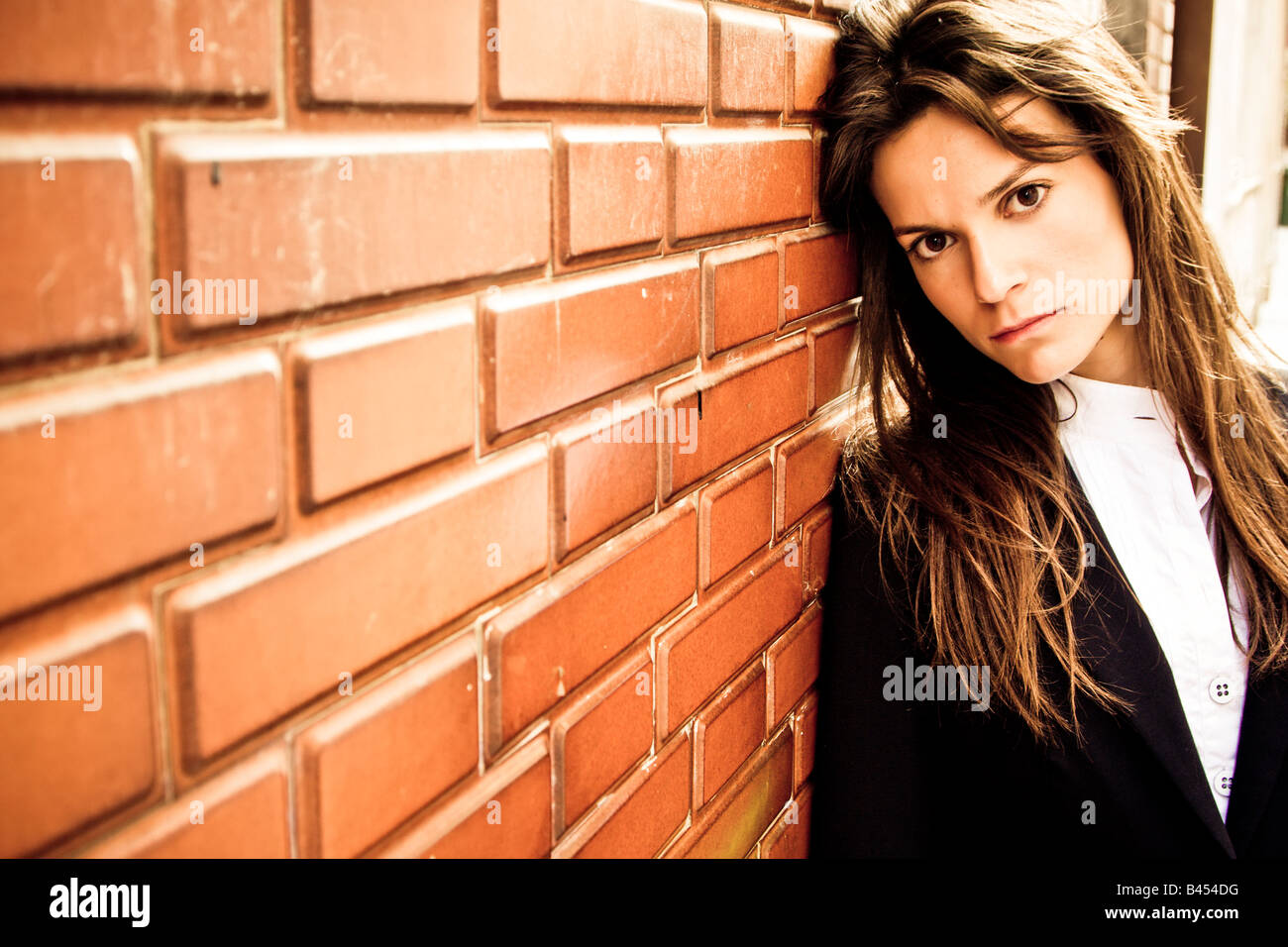 Long haired businesswoman staring at camera Stock Photo