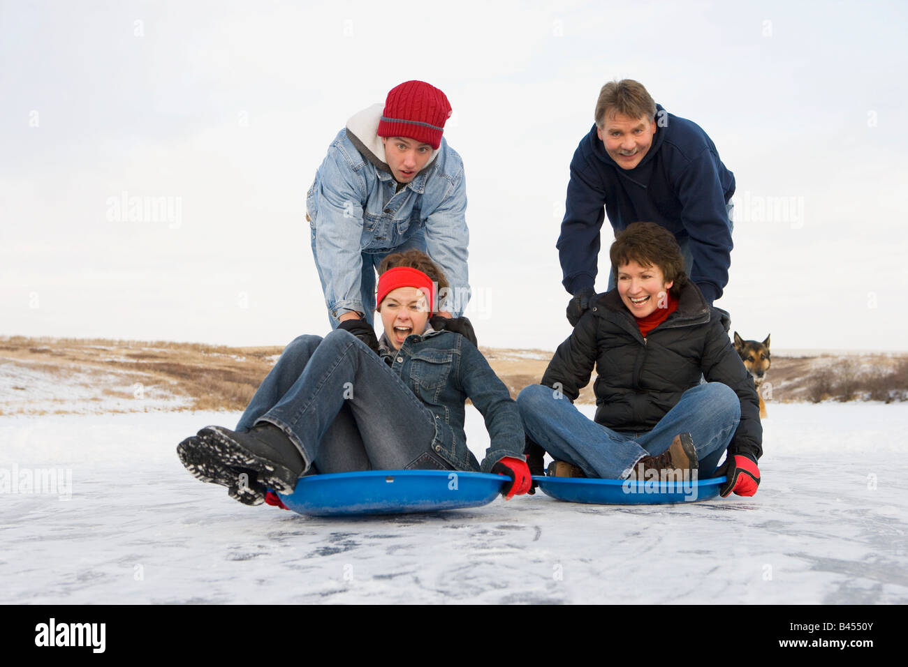 Family enjoying the winter Stock Photo - Alamy