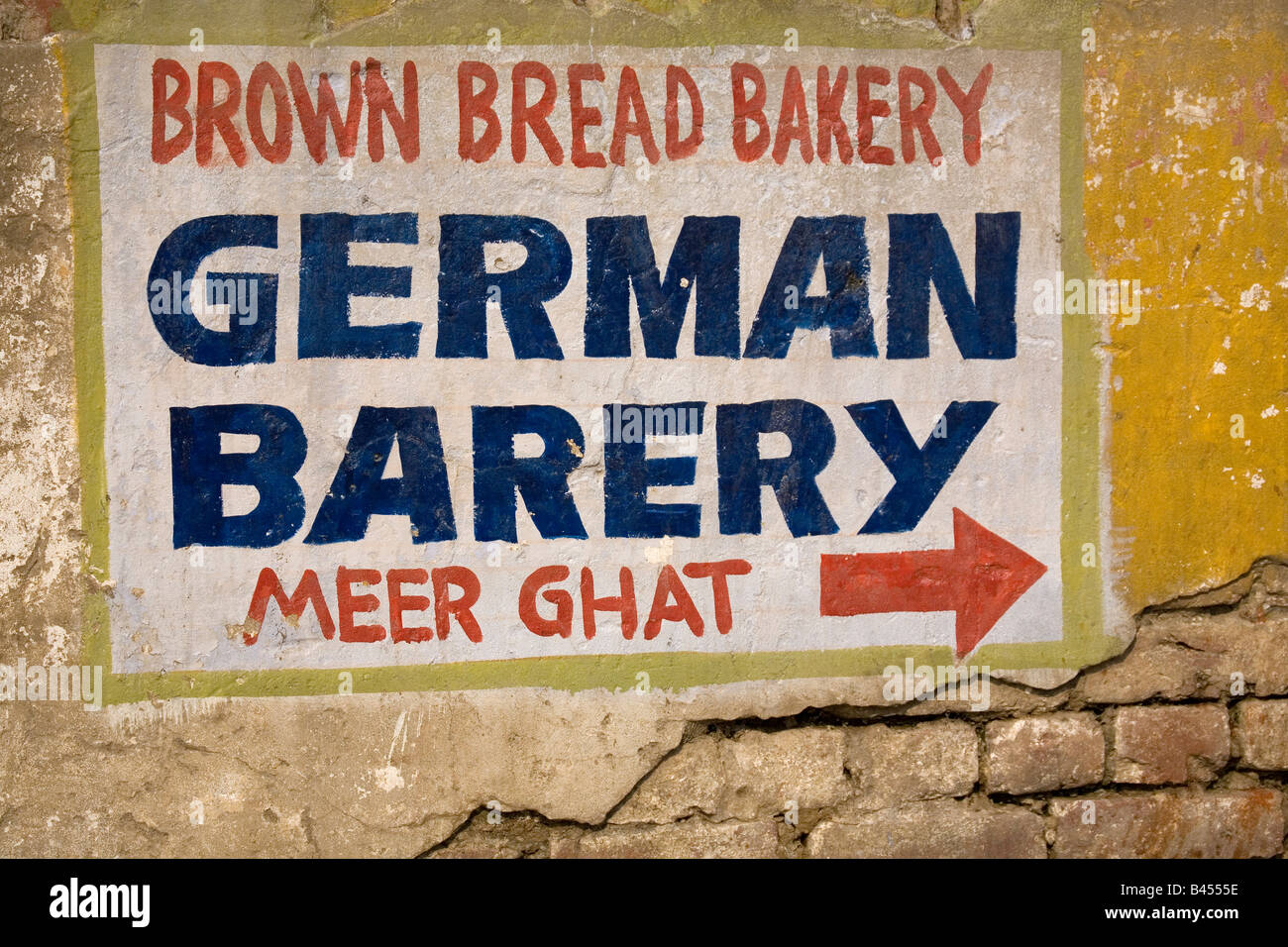 A badlly written advert for a German Bakery in Varanasi, India. Bakery is written Barery Stock