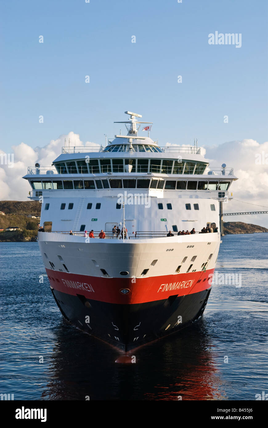 Hurtigruten, Norwegian coastal ferry arrives at port in the village of ...